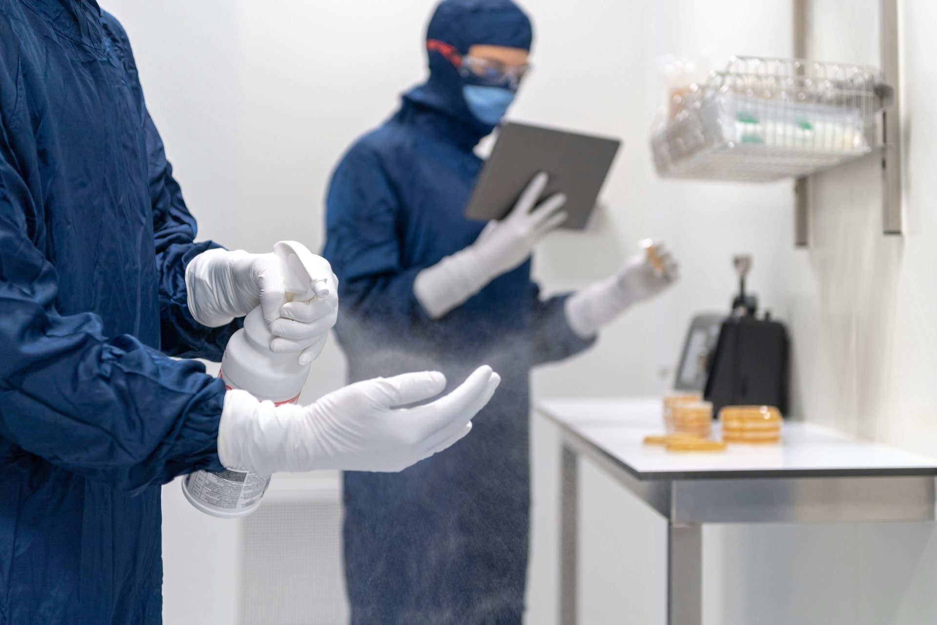 a couple of people wearing gloves and masks and gloves
